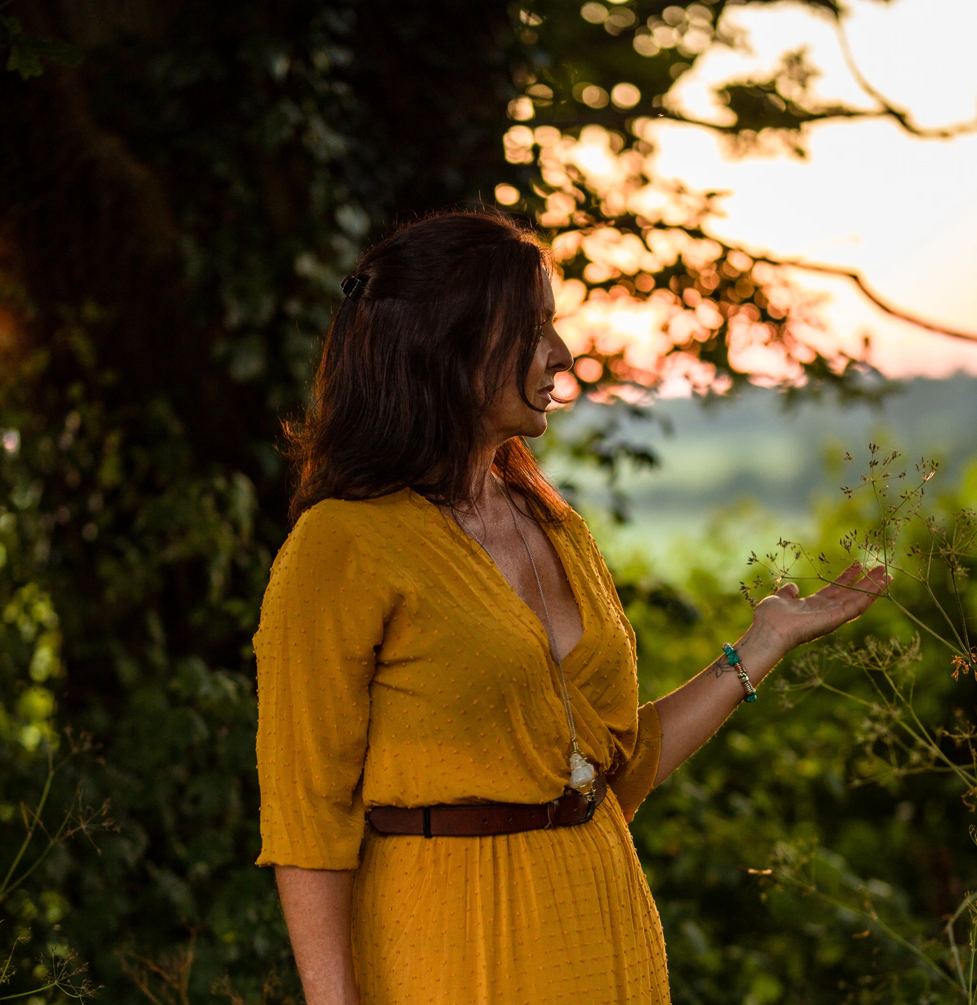 Louise outdoors in nature representing intuitive guidance and energy healing support